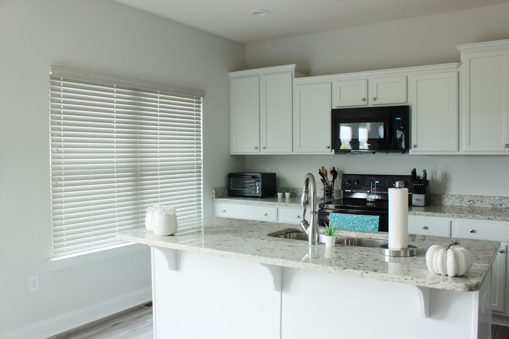 Comfortex Aria Faux Wood Blinds in Kitchen